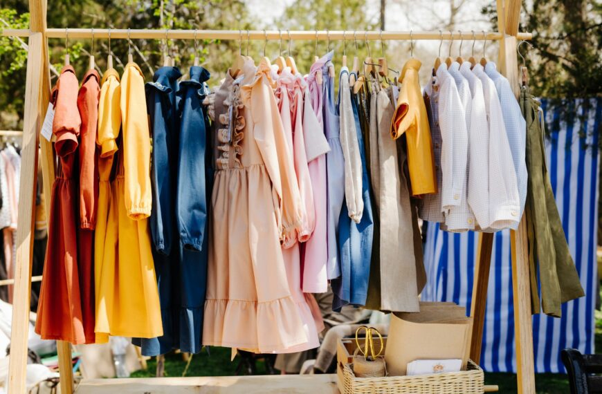 Clothes at a street garage sale. Children's clothing at a street fair.
