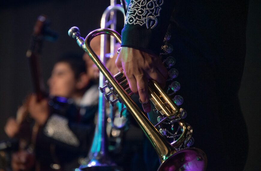 MEXICAN MUSICIAN MARIACHI WITH TRADITIONAL TRUMPET IN MEXICAN SERENATA