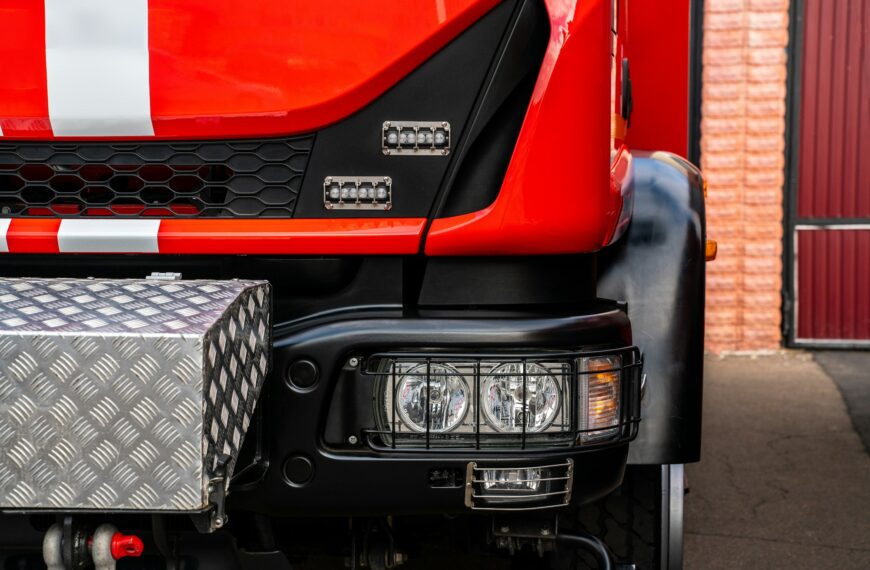 Red fire truck. Cropped view of the firefighting technological transport.