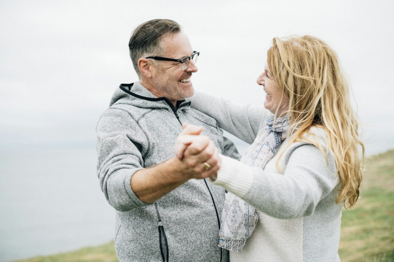 Romantic senior couple dancing outdoors