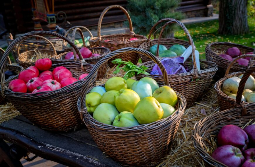 Close up of autumn harvest in wicker baskets on a wooden table