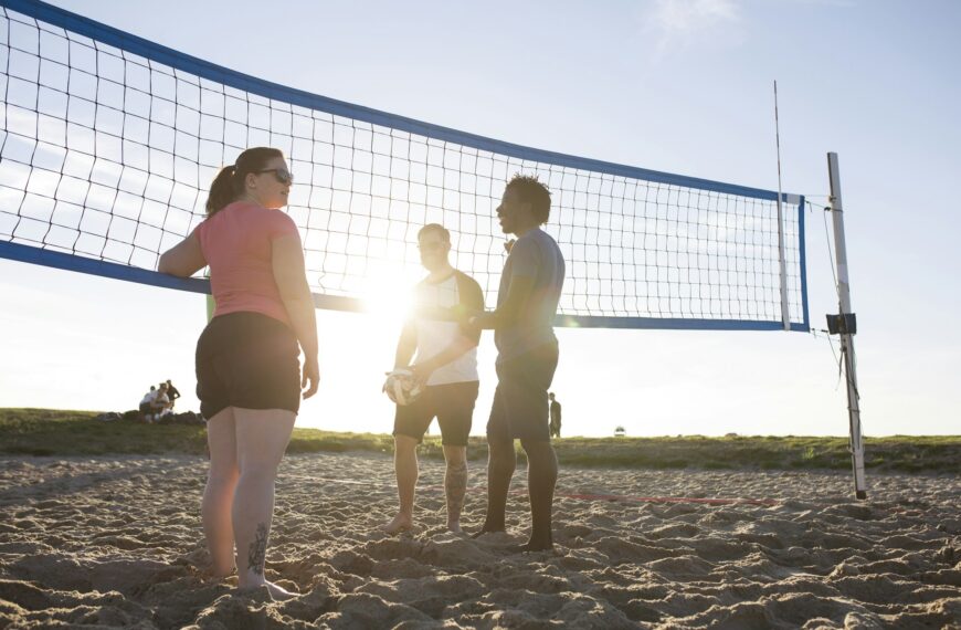 Friends playing volleyball on beach