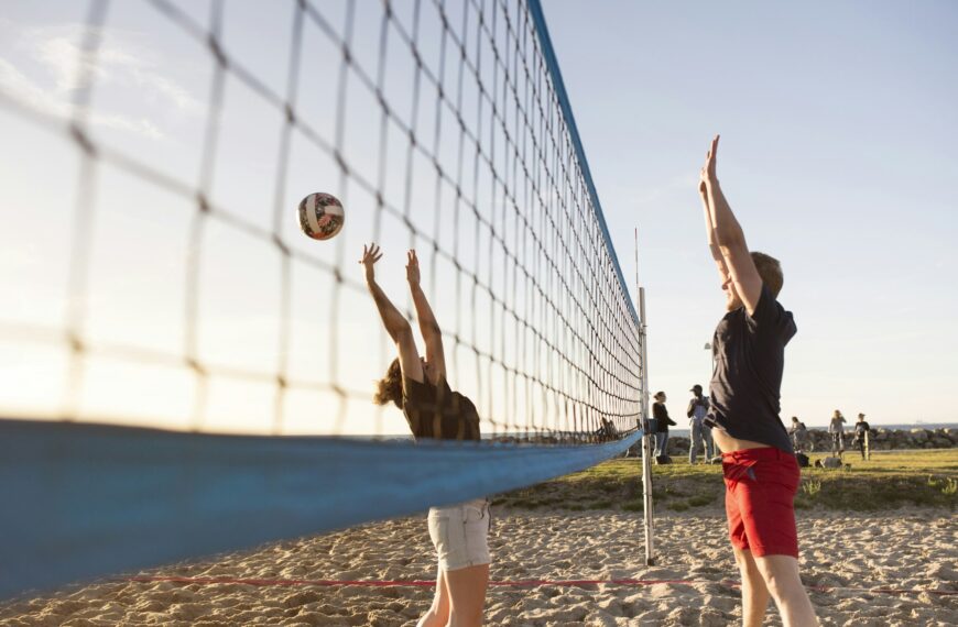 Friends playing volleyball on beach