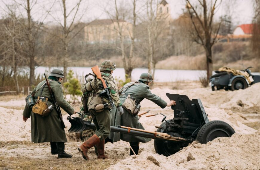Re-enactors Dressed As German Wehrmacht Soldiers In WWII Roll Ou