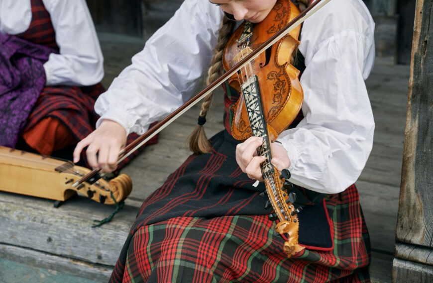 Woman playing a violin in Valdres Folk Museum and Nordre Land in Oppland, Norway