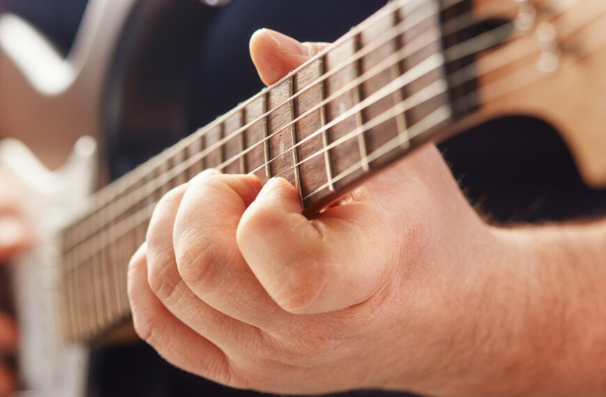 playing on electric guitar