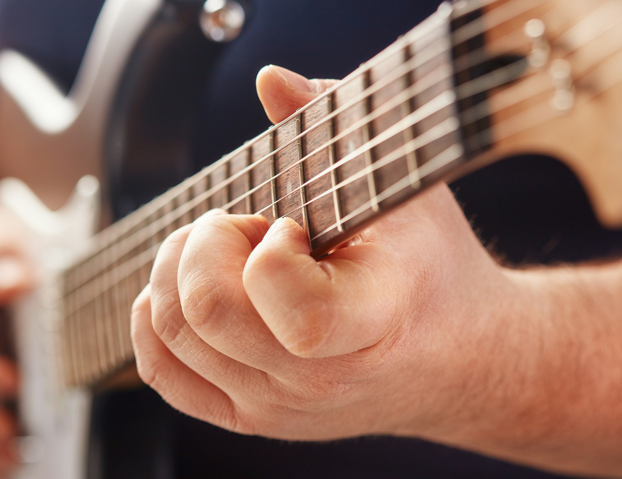 playing on electric guitar