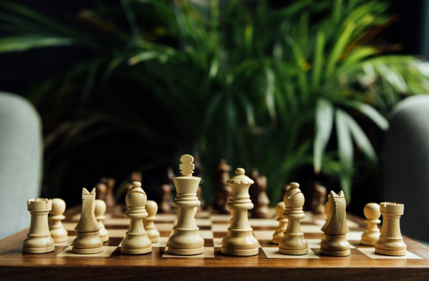 Closeup view of chess set on chess board. Selective focus on white chess figures
