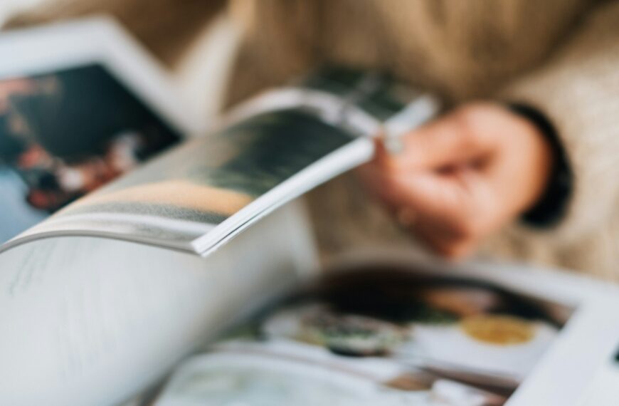 Woman flips through magazine pages