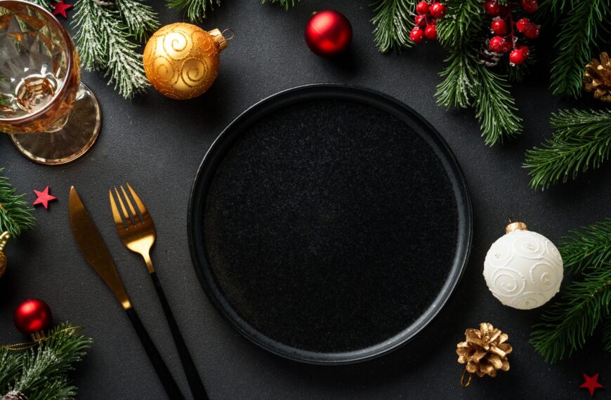 Christmas food. Christmas decorations with holiday dishes on black.