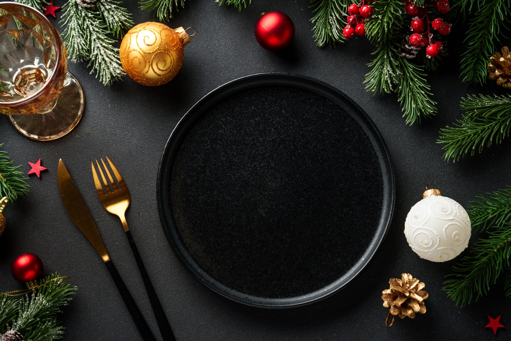 Christmas food. Christmas decorations with holiday dishes on black.