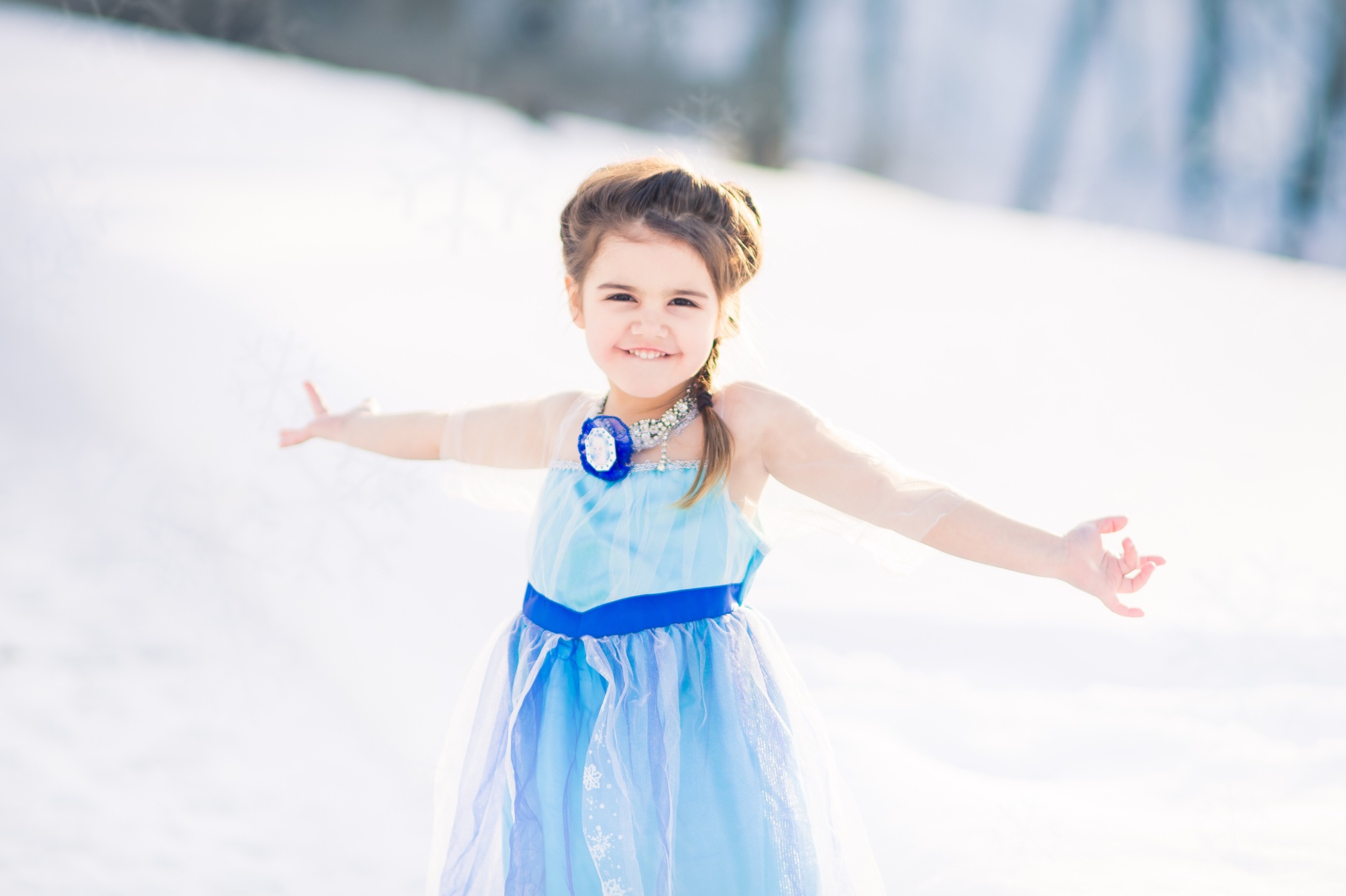 Little pretending to be Queen Elsa in the snow
