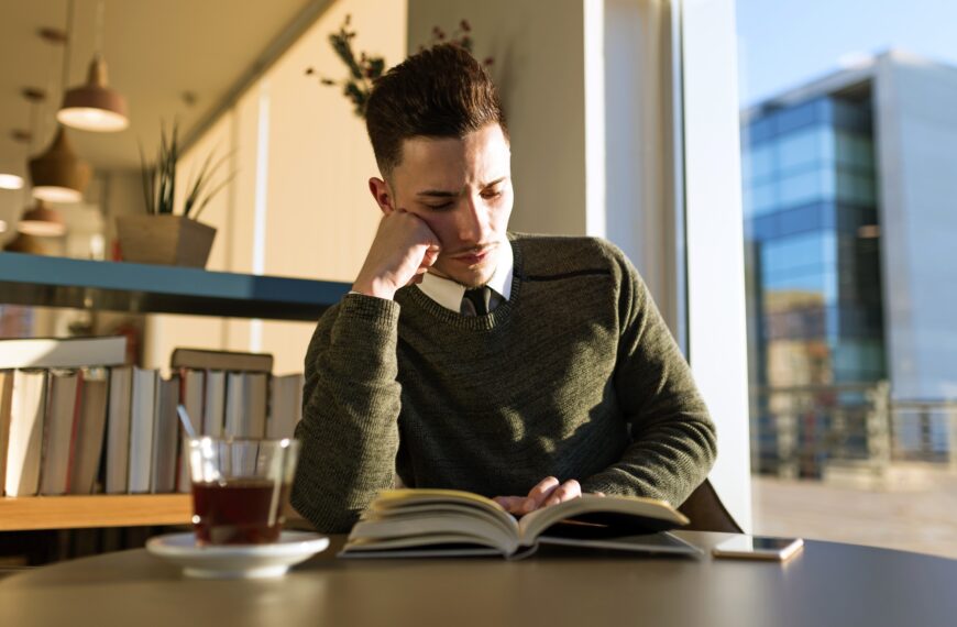 Pensive man reading a book