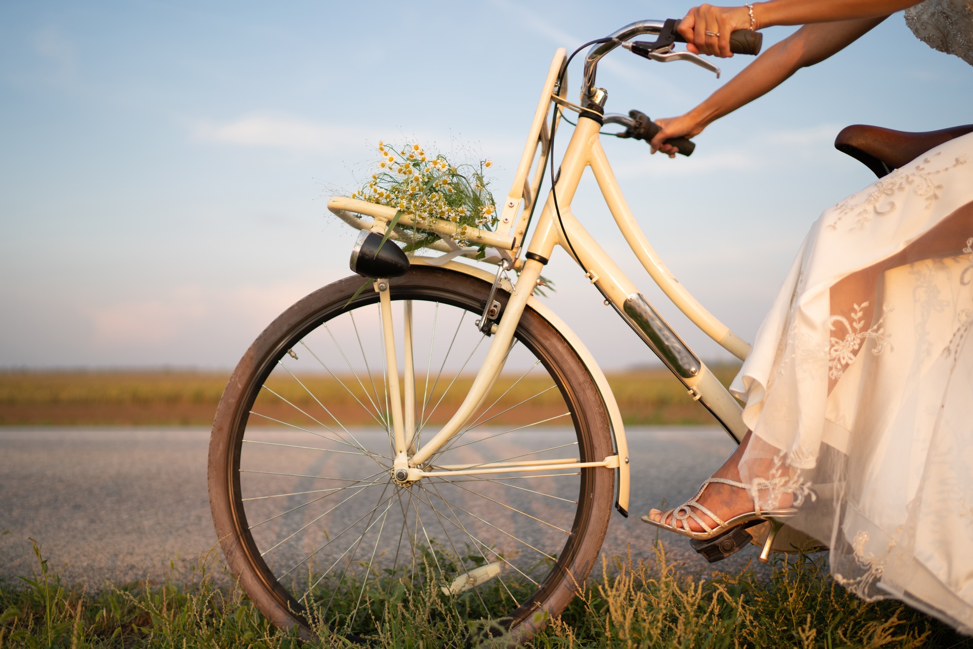 The bride is riding a bicycle