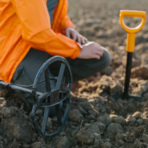 A man with a metal detector does archeology.